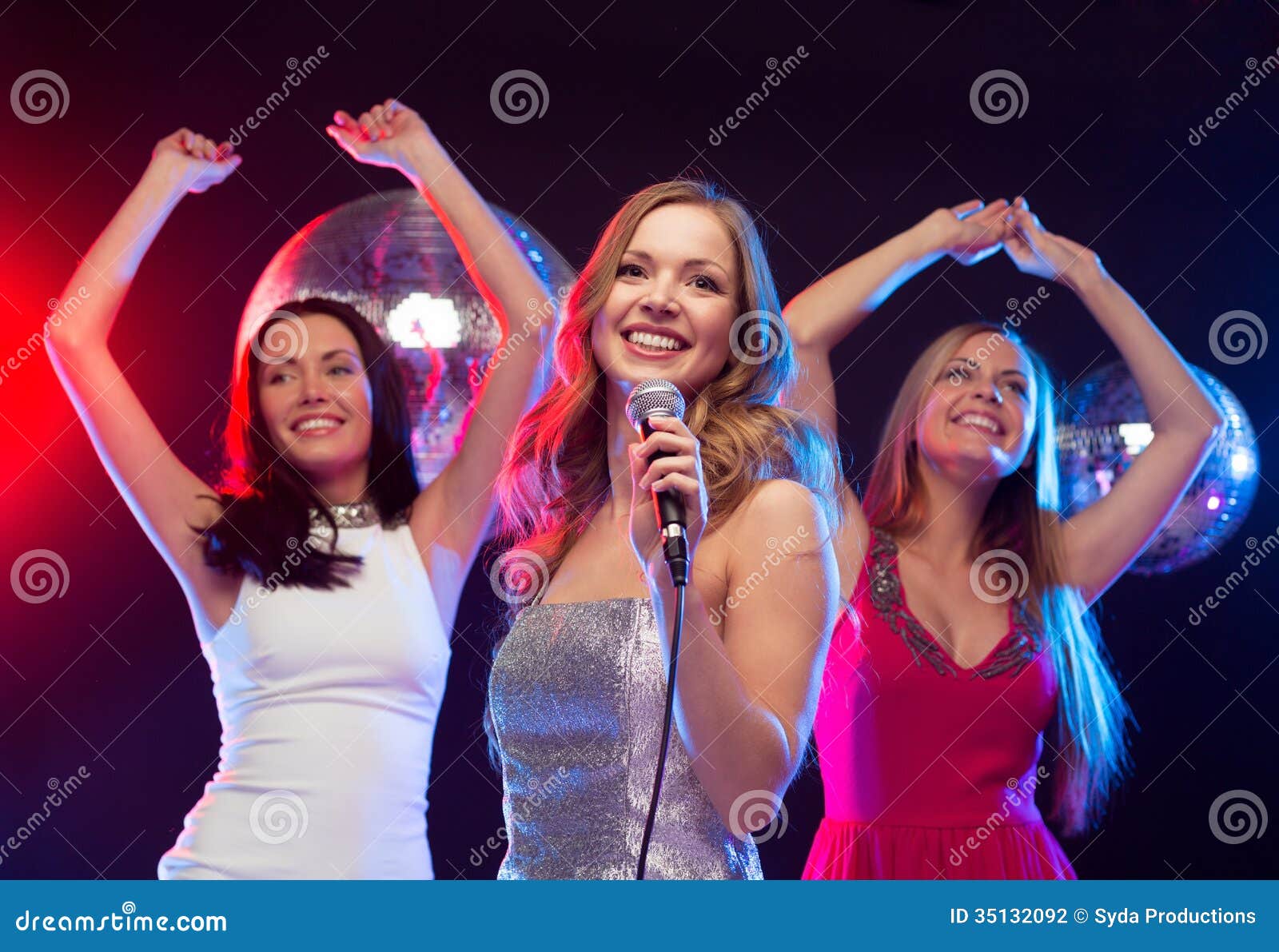 Three Smiling Women Dancing and Singing Karaoke Stock Photo - Image of ...
