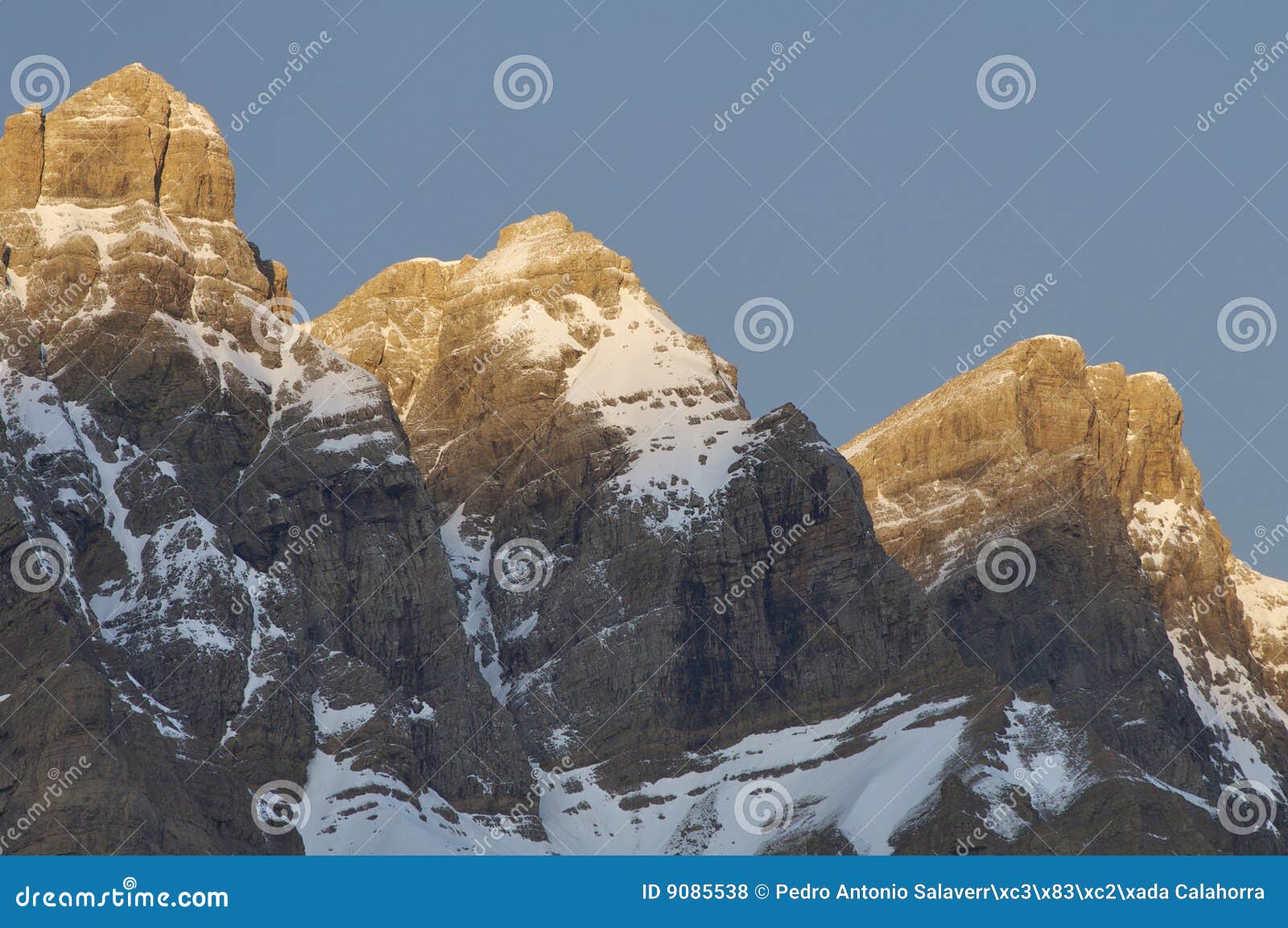 three snow-capped peaks