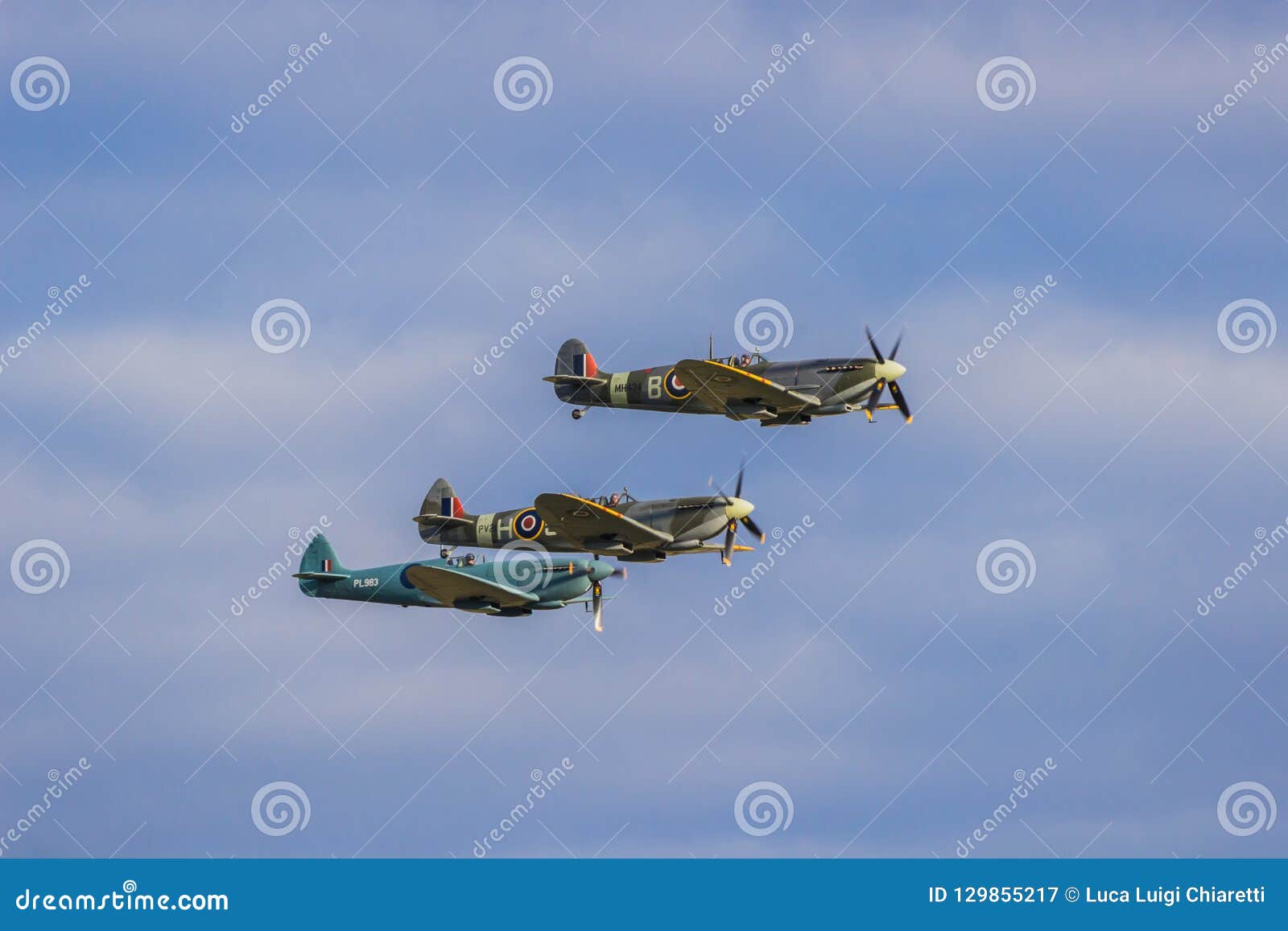 Three Spitfire in flight editorial photography. Image of england