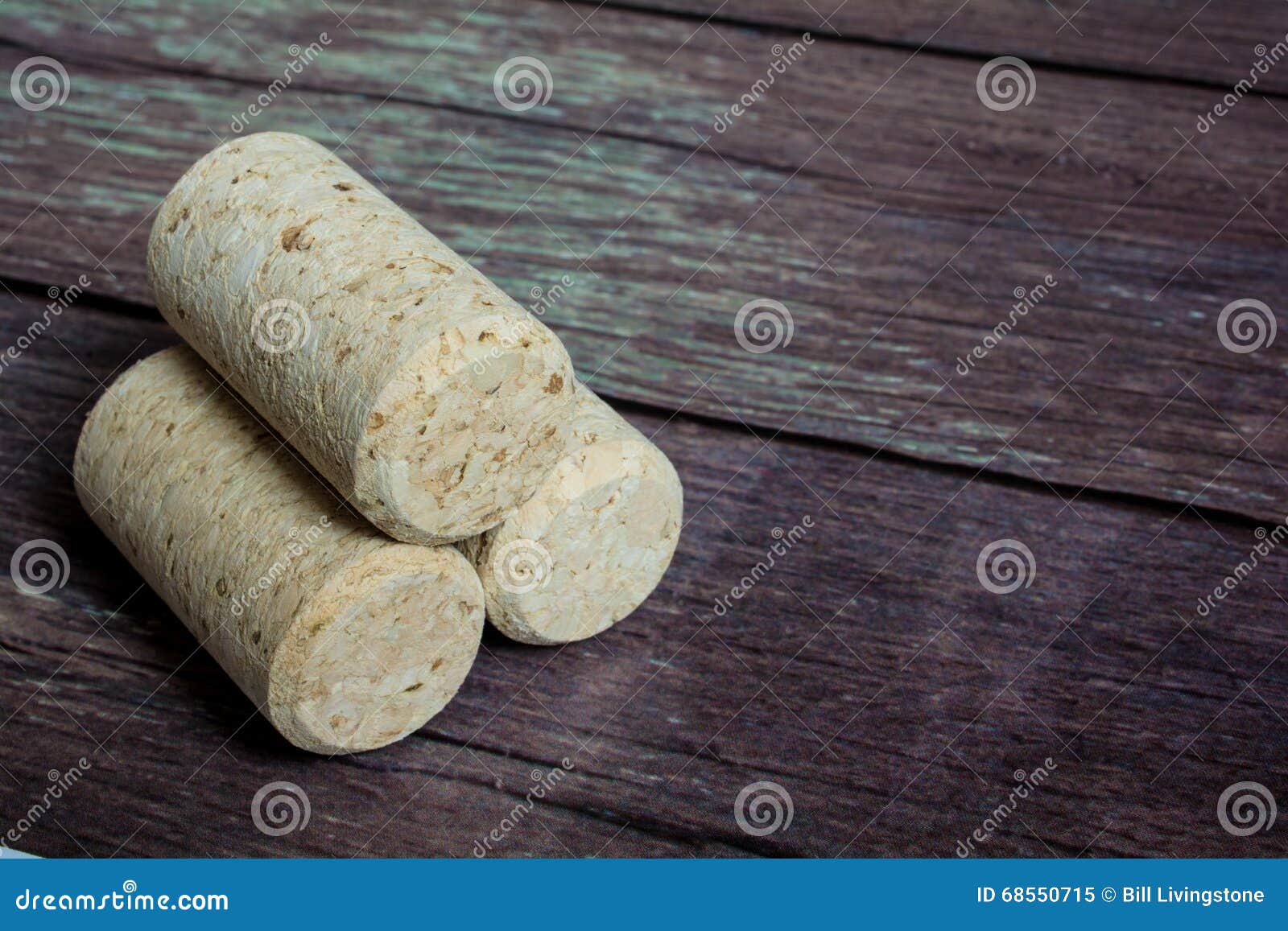 Three Stacked Cork Stoppers On A Old Barn Board Floor Stock Image