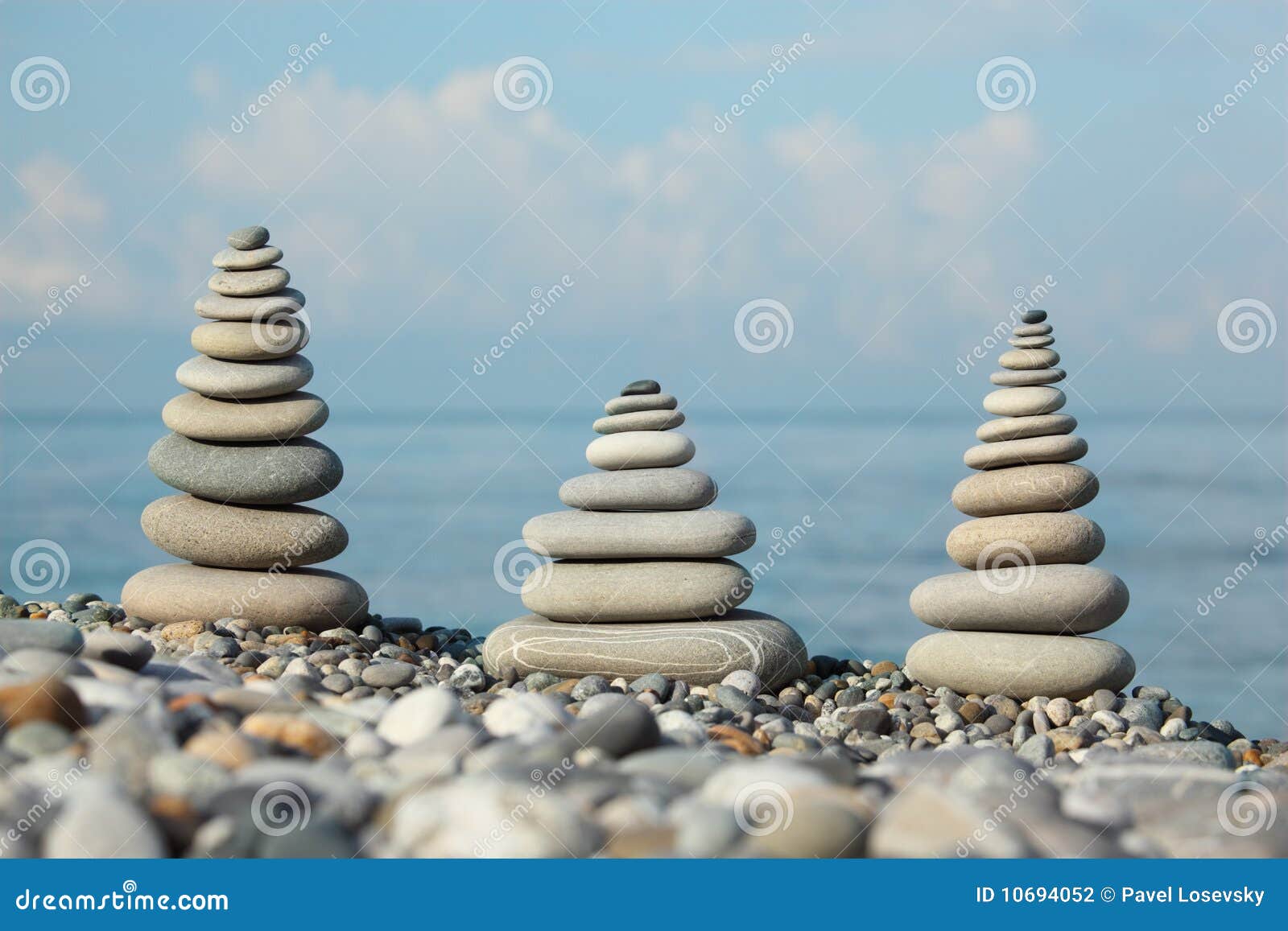three stone stacks on pebble beach