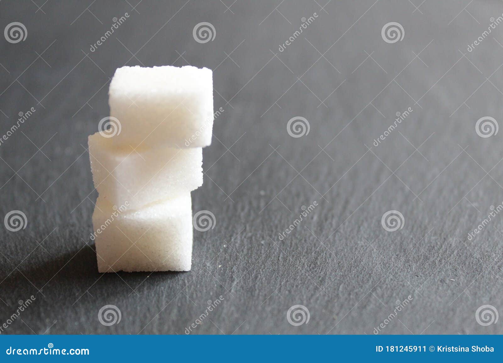 Three Sugar Cubes are Stacked on Top of Each Other or in a Pyramid on a ...