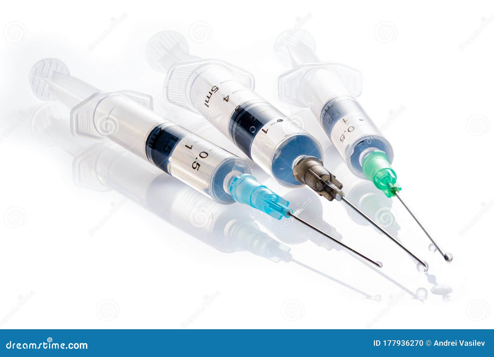 Three Syringes with Medicinal Solution, on White Background with