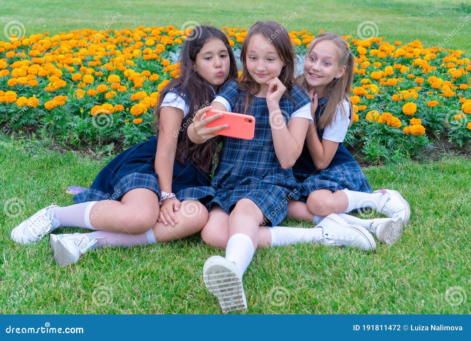 Three Teen Girls Take A Selfie Phone On A Sunny D