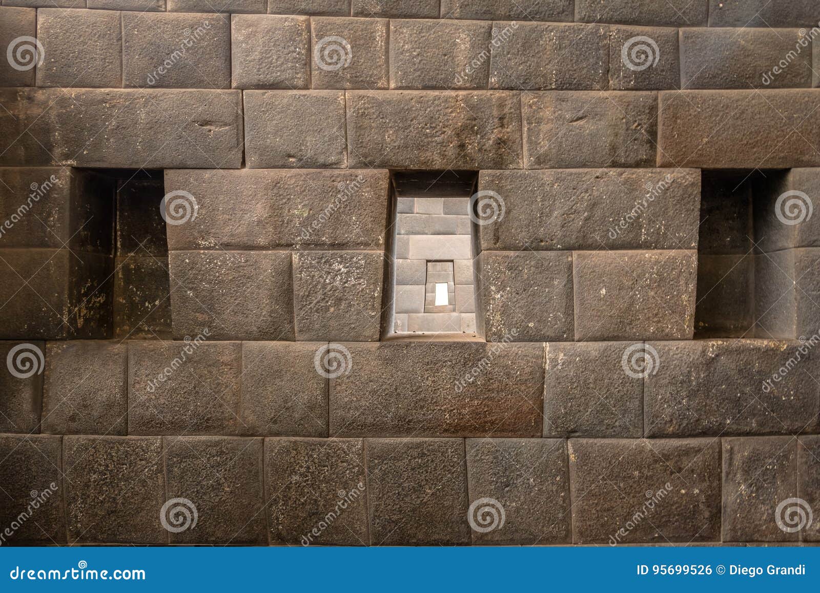the three trapezoidal windows and inca wall of rainbow temple at qoricancha inca ruins - cusco, peru
