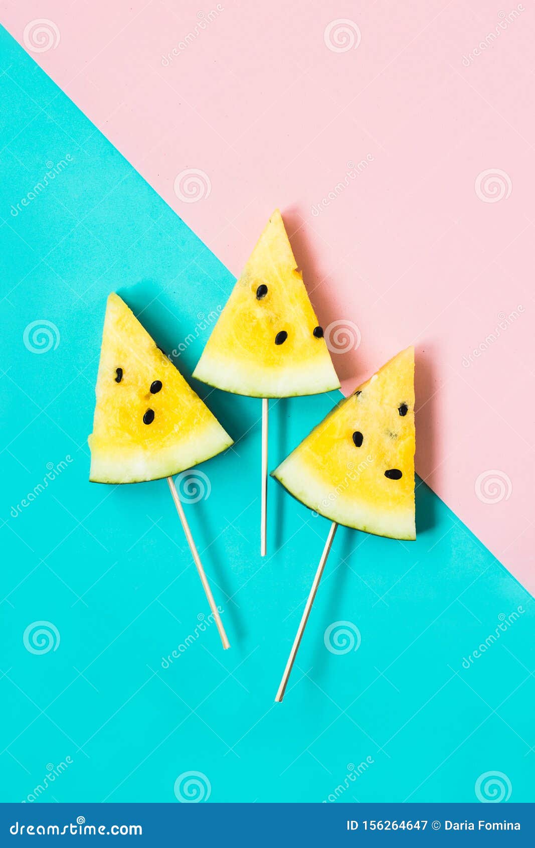Three Triangular Ice Cream Slices on a Stick of Ripe Yellow Watermelon ...