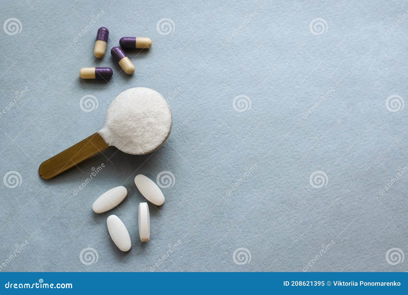 three types of collagen in powder, tablets and capsules on a gray background. measuring spoon with powdered hydrolyzed
