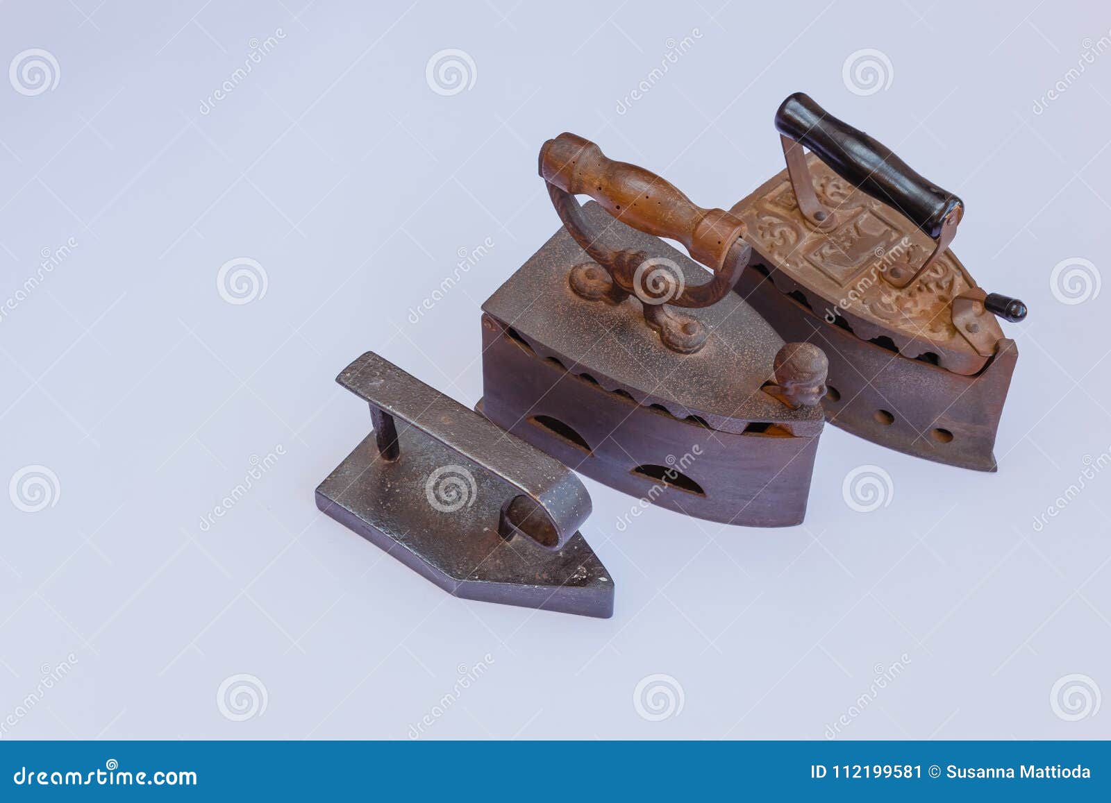Three vintage irons stock image. Image of black, wall 112199581