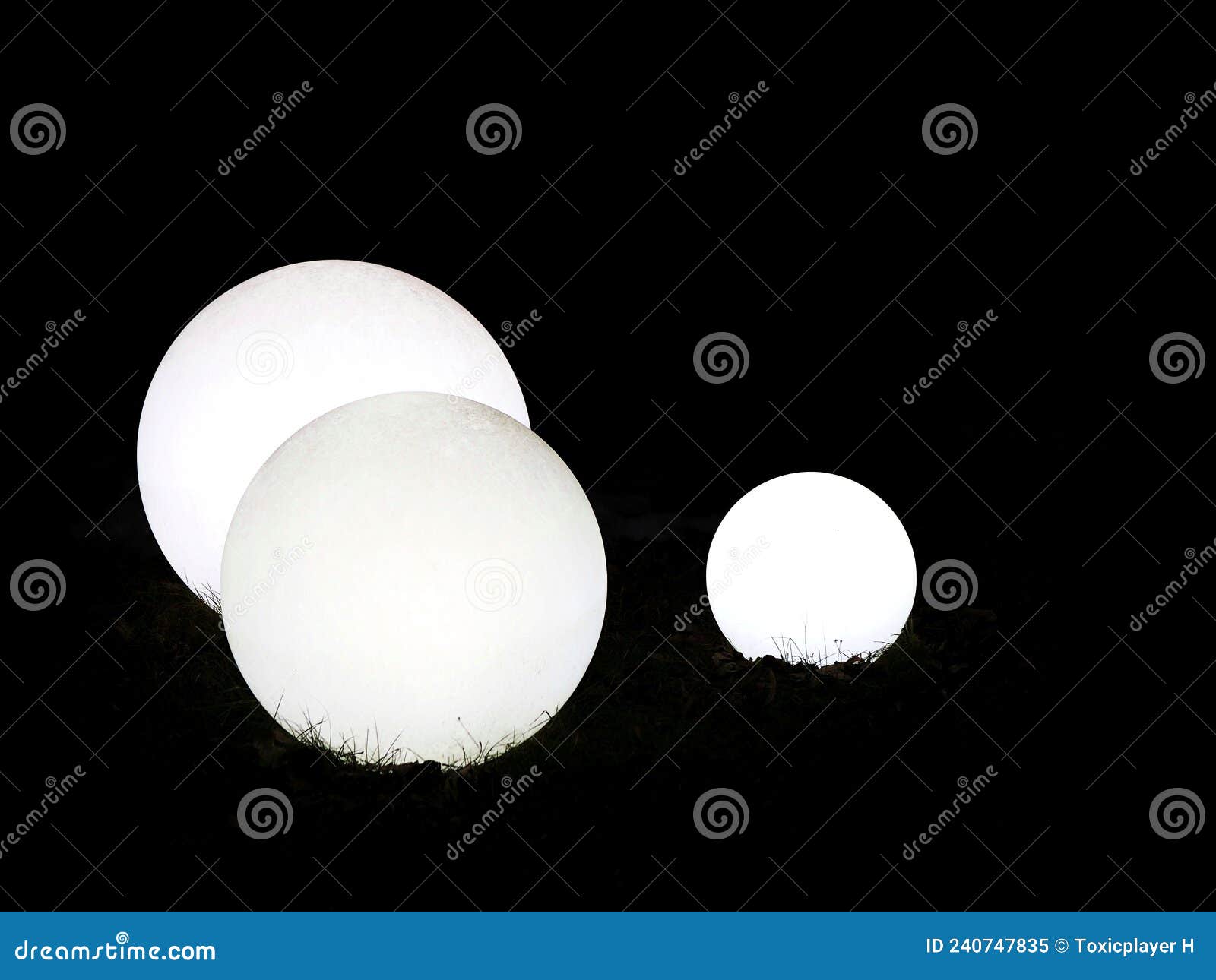 Three White Decorative Spheres Lit Up in a Garden at Night Time Stock Image Image of line