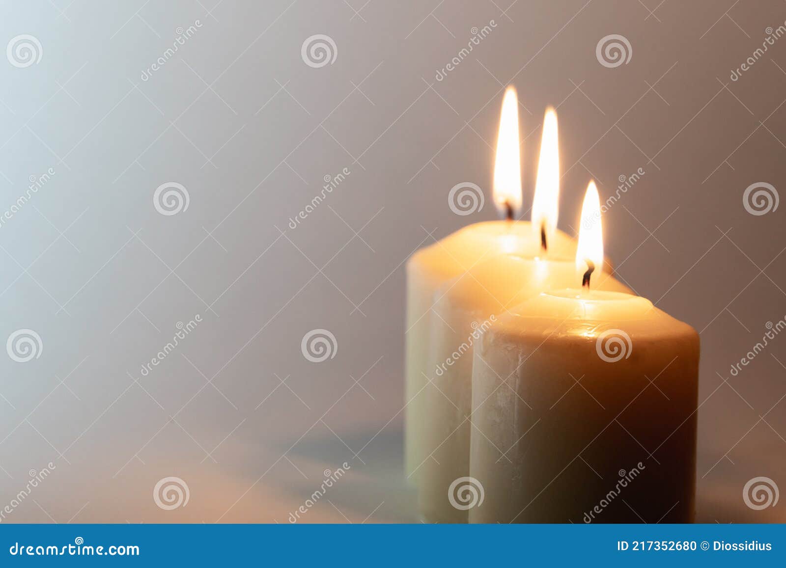 Three white lit candles stock photo. Image of streetlight 217352680