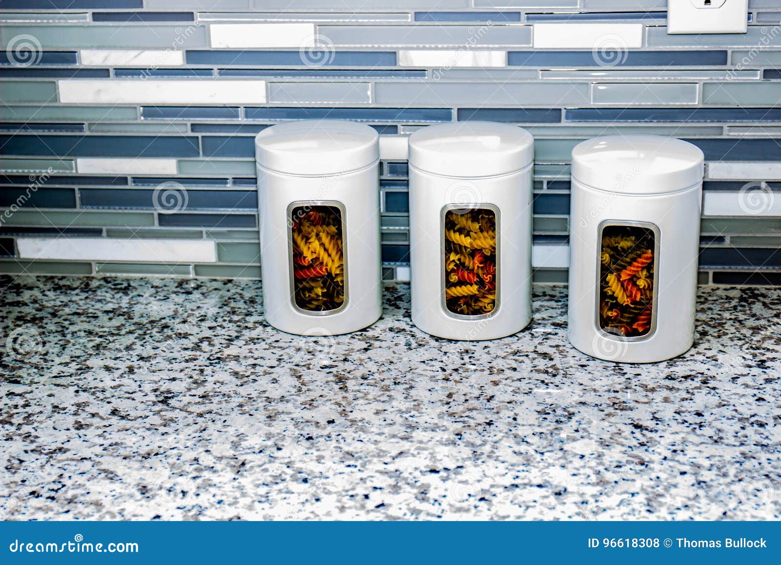 Three White Pasta Canisters On Kitchen Counter Stock Photo Image