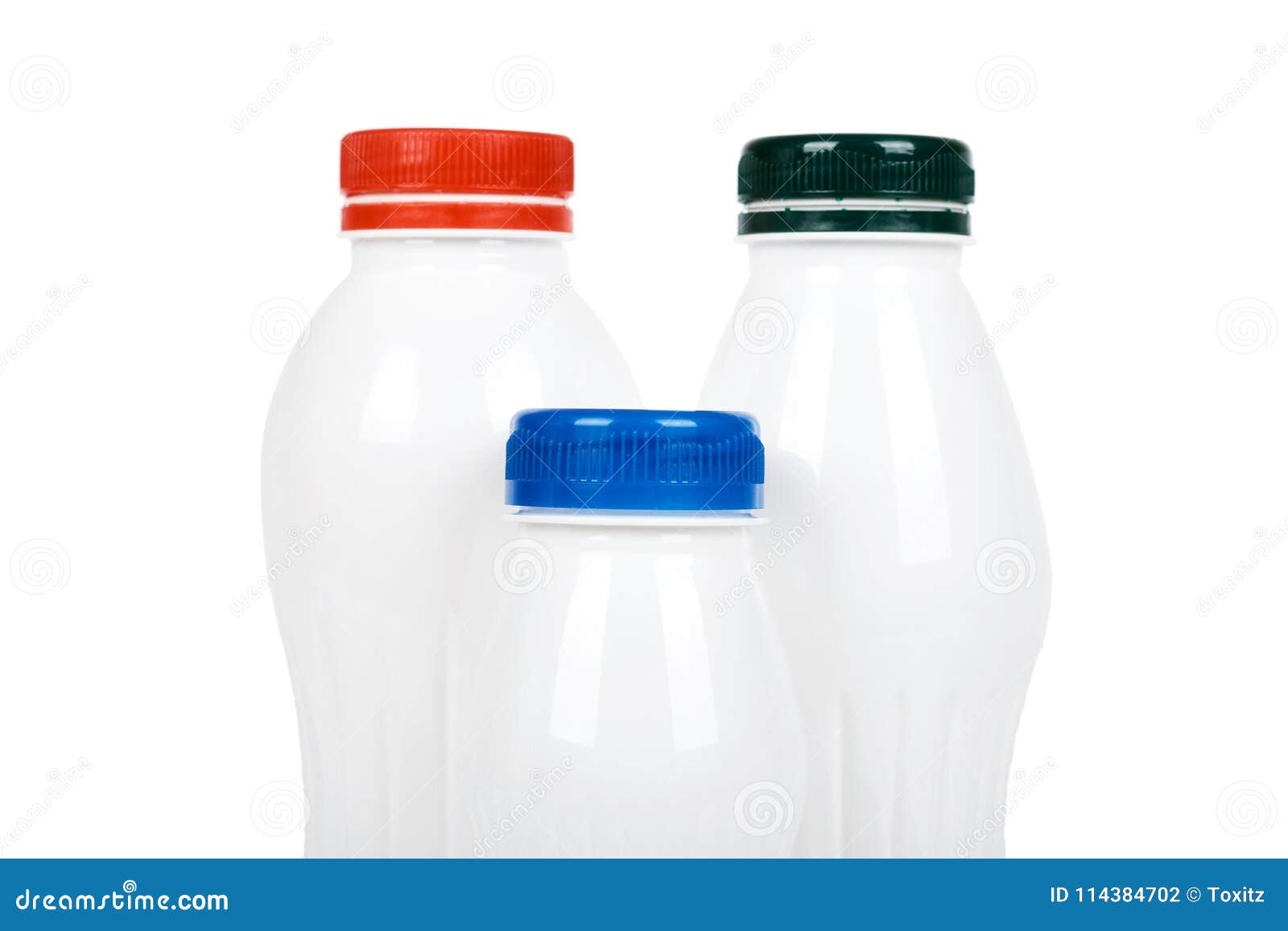 Three White Plastic Bottles With Drink Yogurt Or Milk. Isolated On