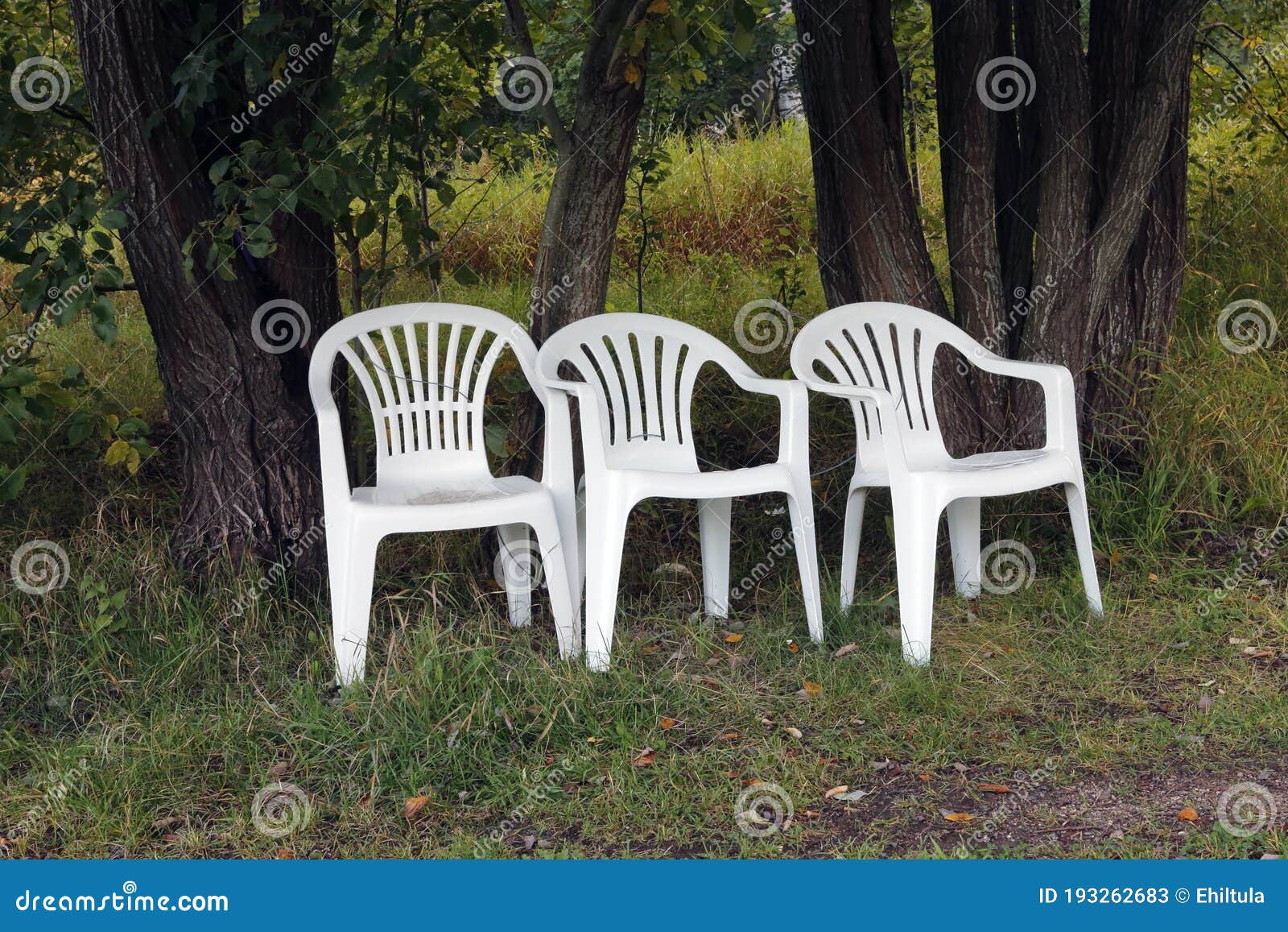 Three White Plastic Chairs Outdoors Stock Image Image of trees, seats