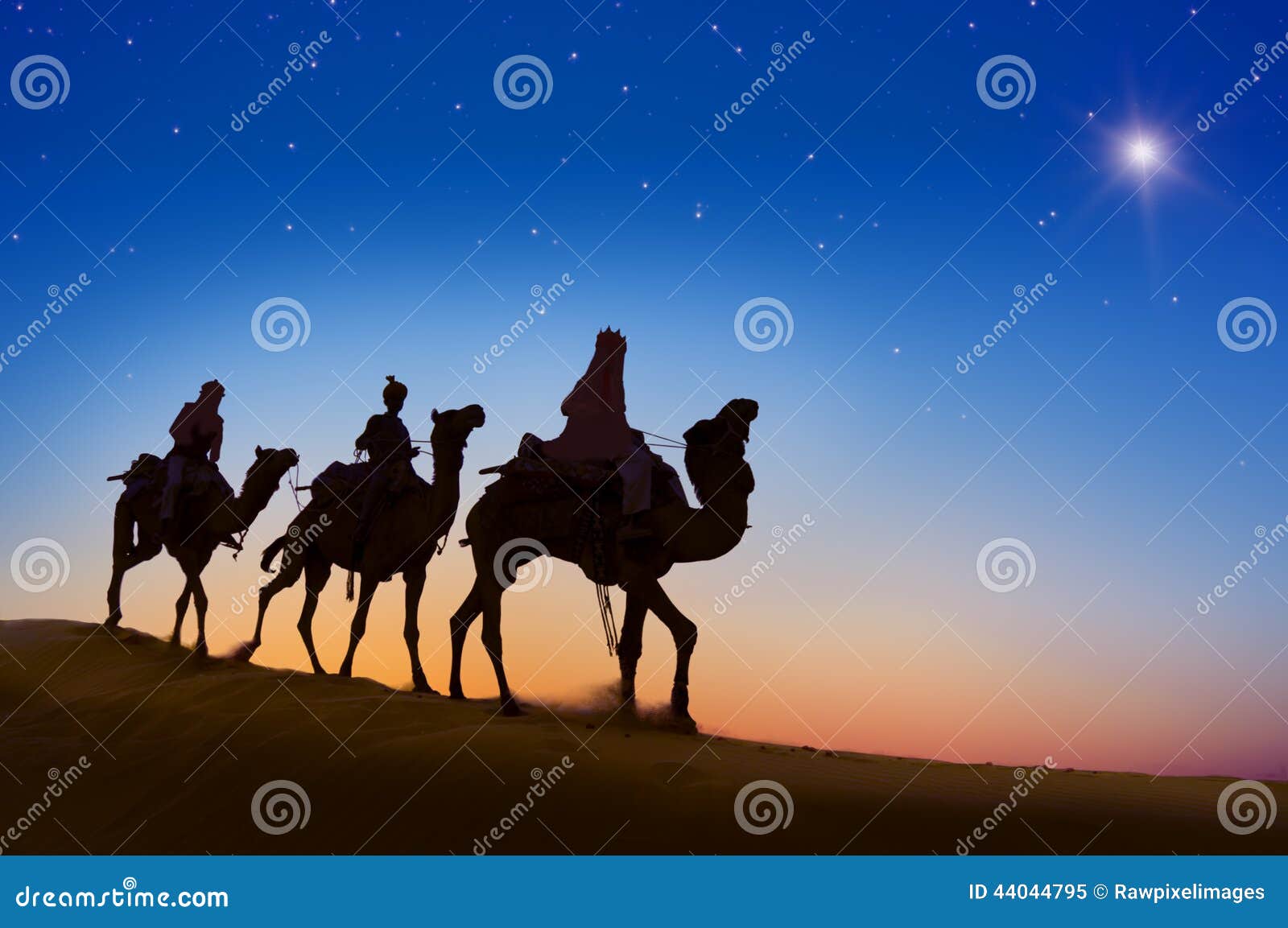 three wise men riding camel on the hill