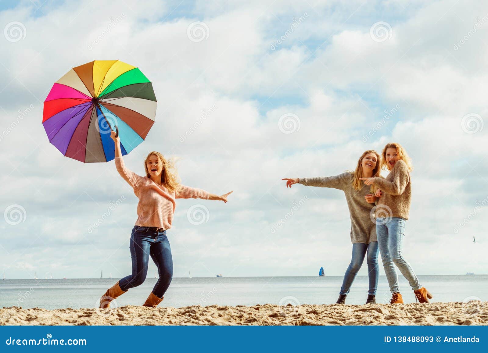 Download Women Holding Umbrella Having Fun With Friends Stock Image ...