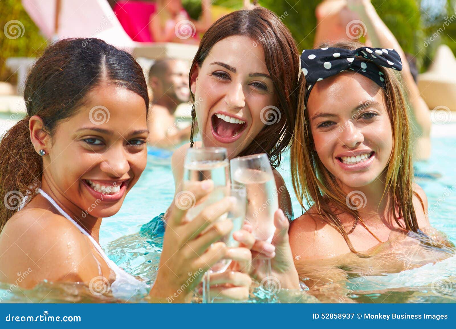 Three Women Having Party In Swimming Pool Drinking