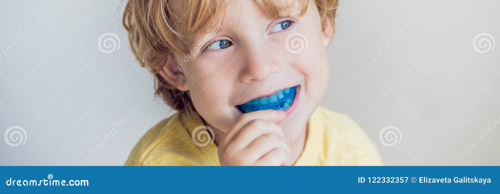 three-year old boy shows myofunctional trainer to illuminate mouth breathing habit. helps equalize the growing teeth and correct b