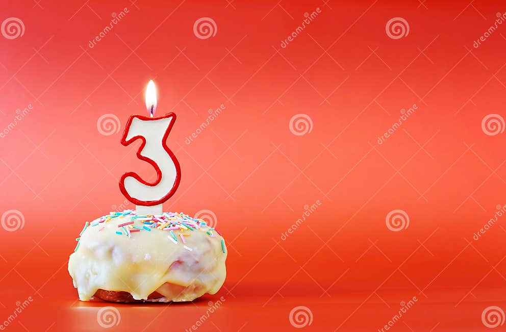 Three Years Birthday. Cupcake with White Burning Candle in the Form of ...