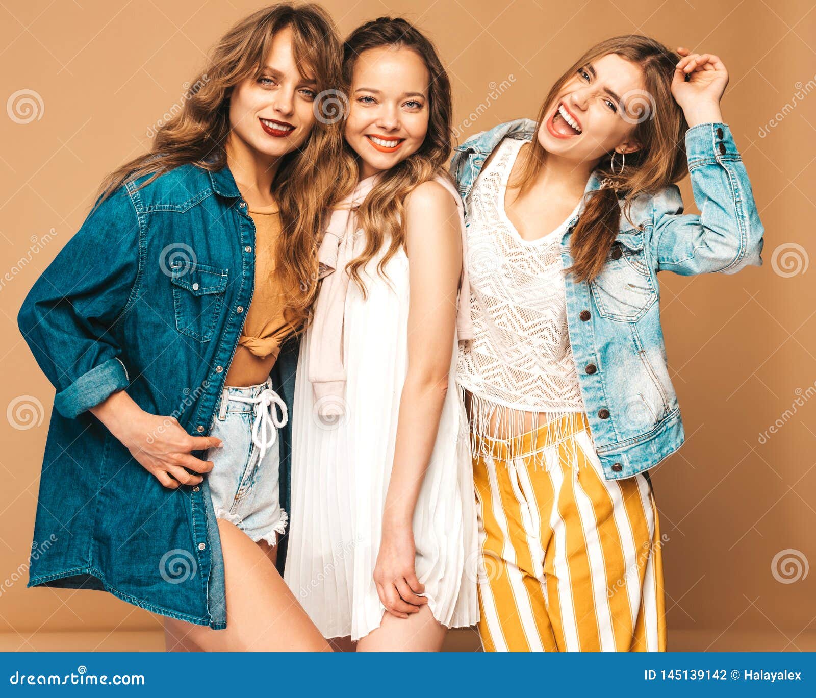 Three Young Beautiful Hipster Girls in Trendy Clothes in Studio Stock ...