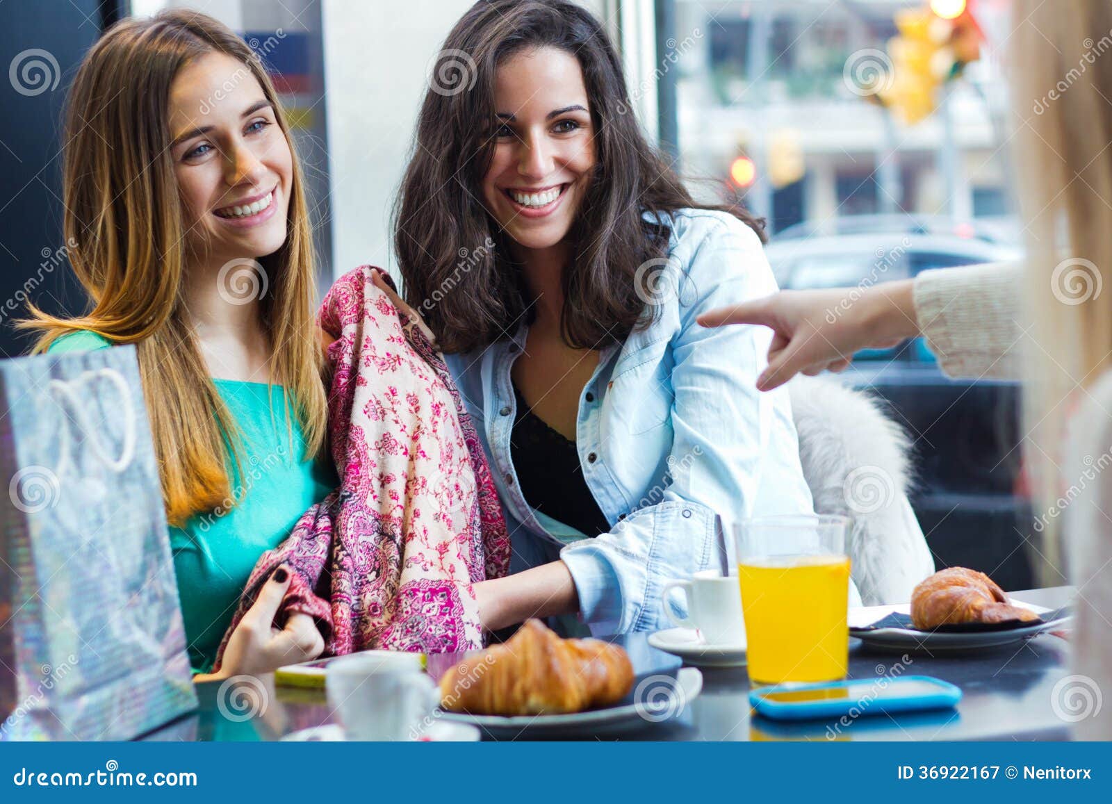 Three Young Friends Having Breakfast on a Morning Shopping in Th Stock ...