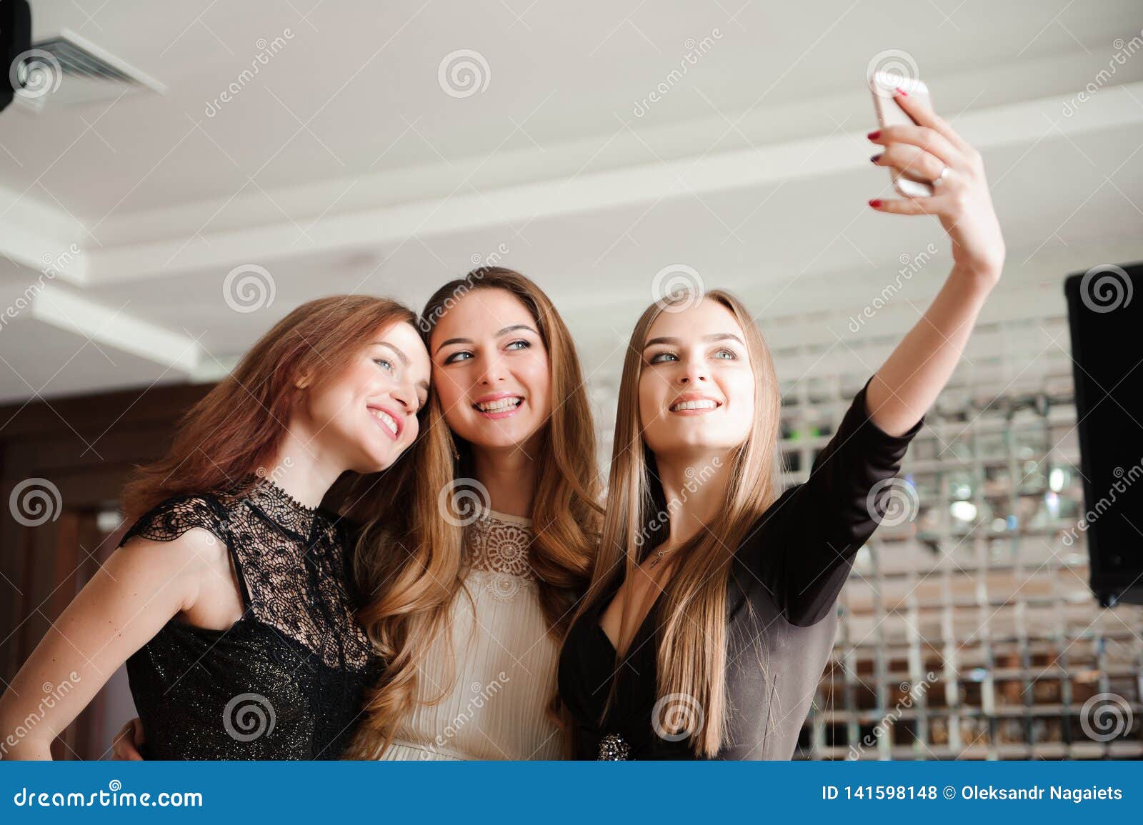 Three Young Girls are Doing Selfie Photo in a Restaurant. Stock Photo ...