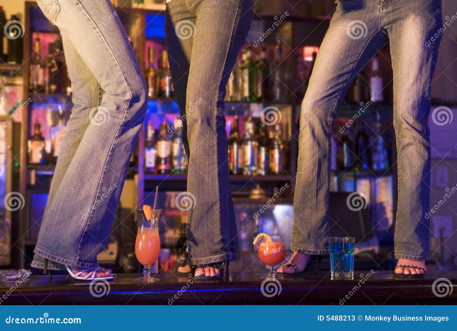 Three Young Women Dancing on a Bar Counter Stock Image Image of