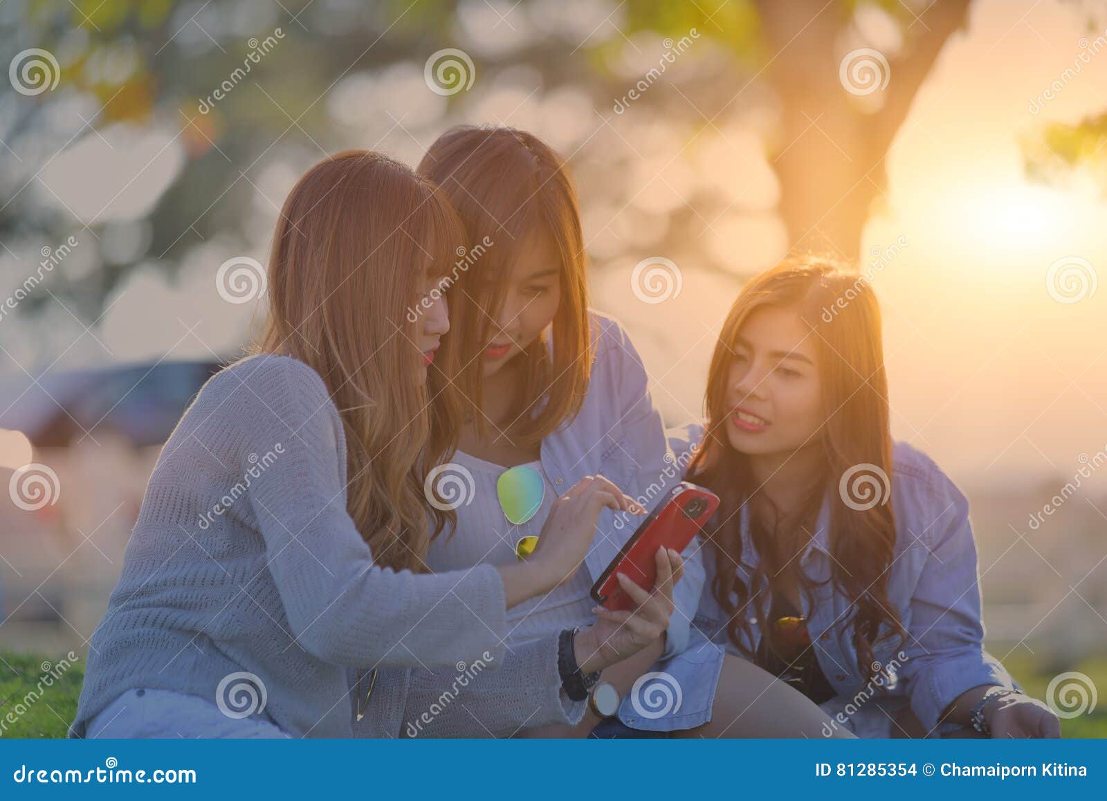 Three Young Women Looking in Mobile Phone. Swag Teen Girls ...