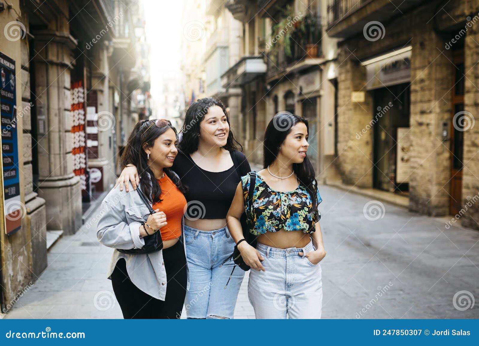 women hanging out on a comercial street