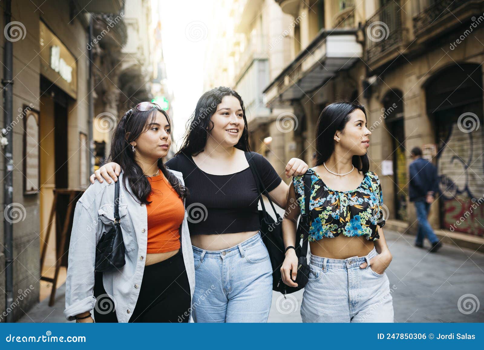 women hanging out on a comercial street