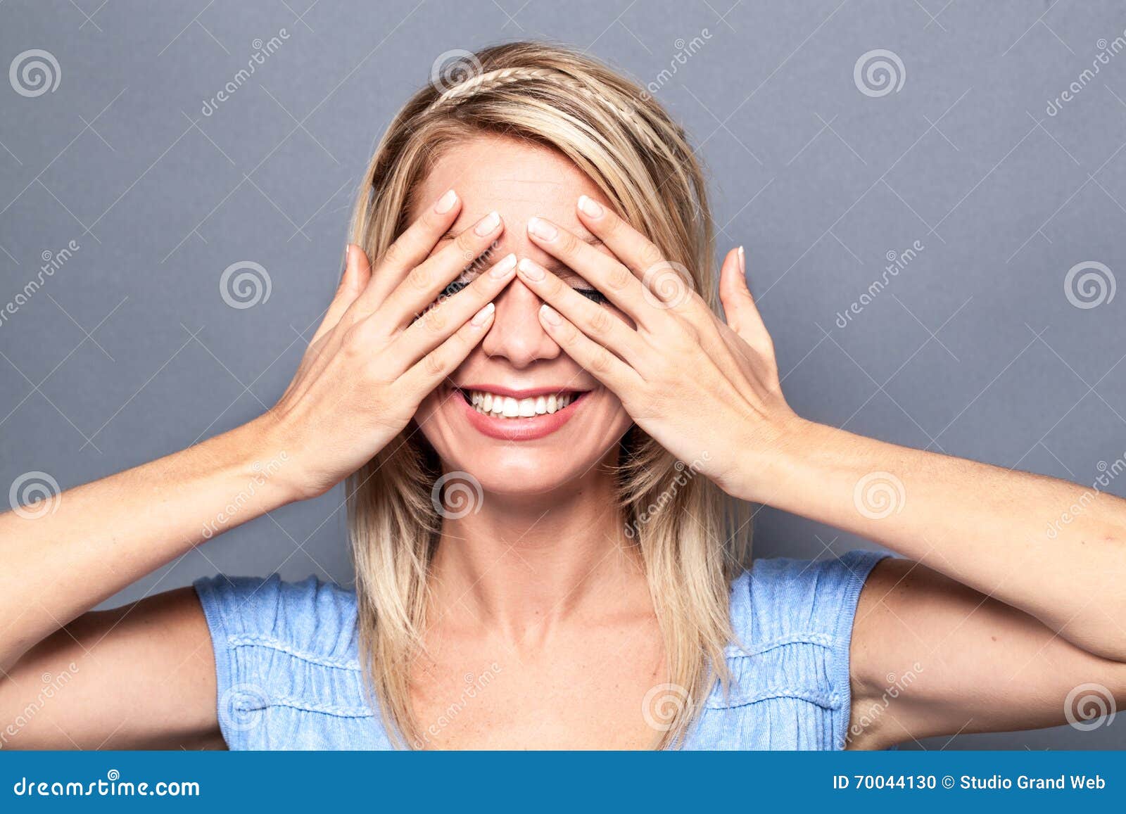 thrilled young blond woman expressing surprise