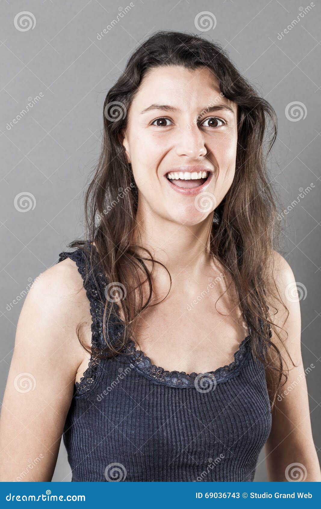 thrilled woman with smiling expressing happiness and wellbeing