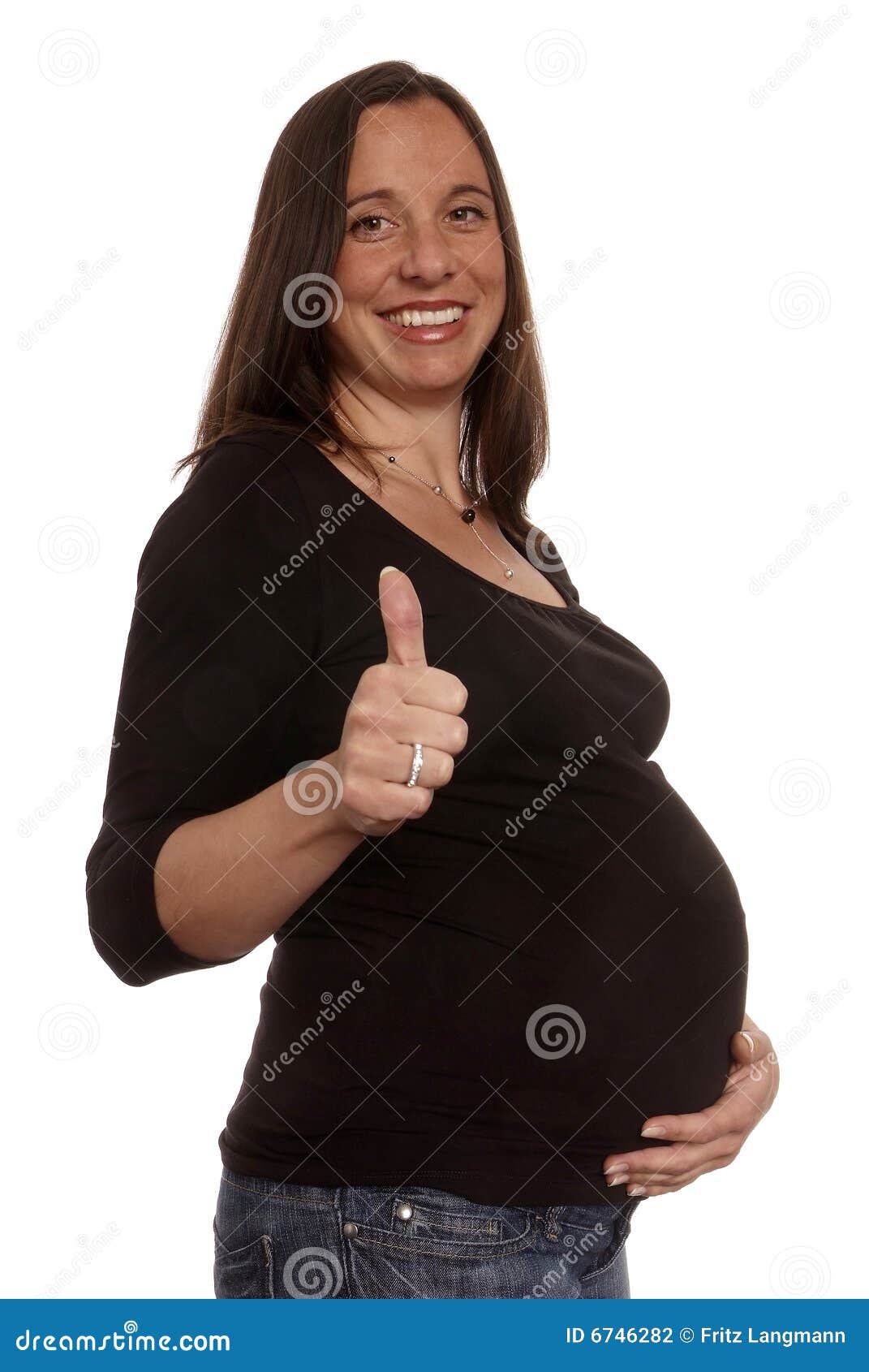 Thumb up. Pregnant woman big belly holding thump up