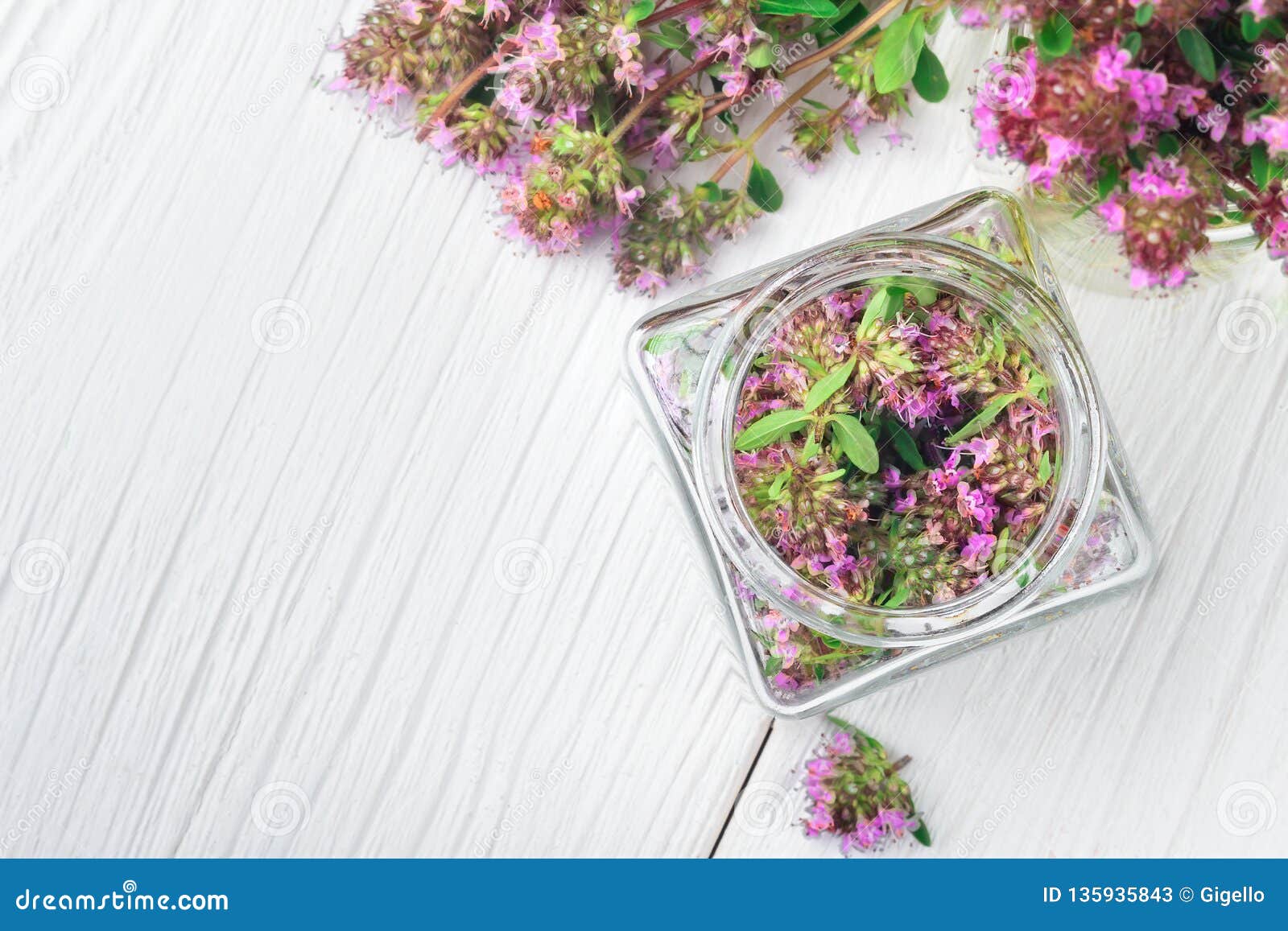 Bottle Of Thyme Essential Oil Or Tincture, Bunch Of Dried Thymus Serpyllum Plants And Wooden