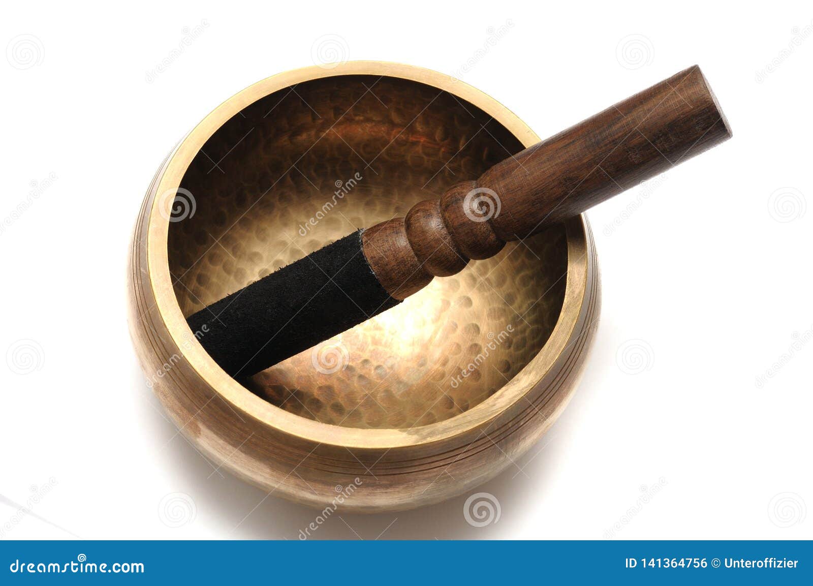 a tibetan singing bowl with a wooden striker