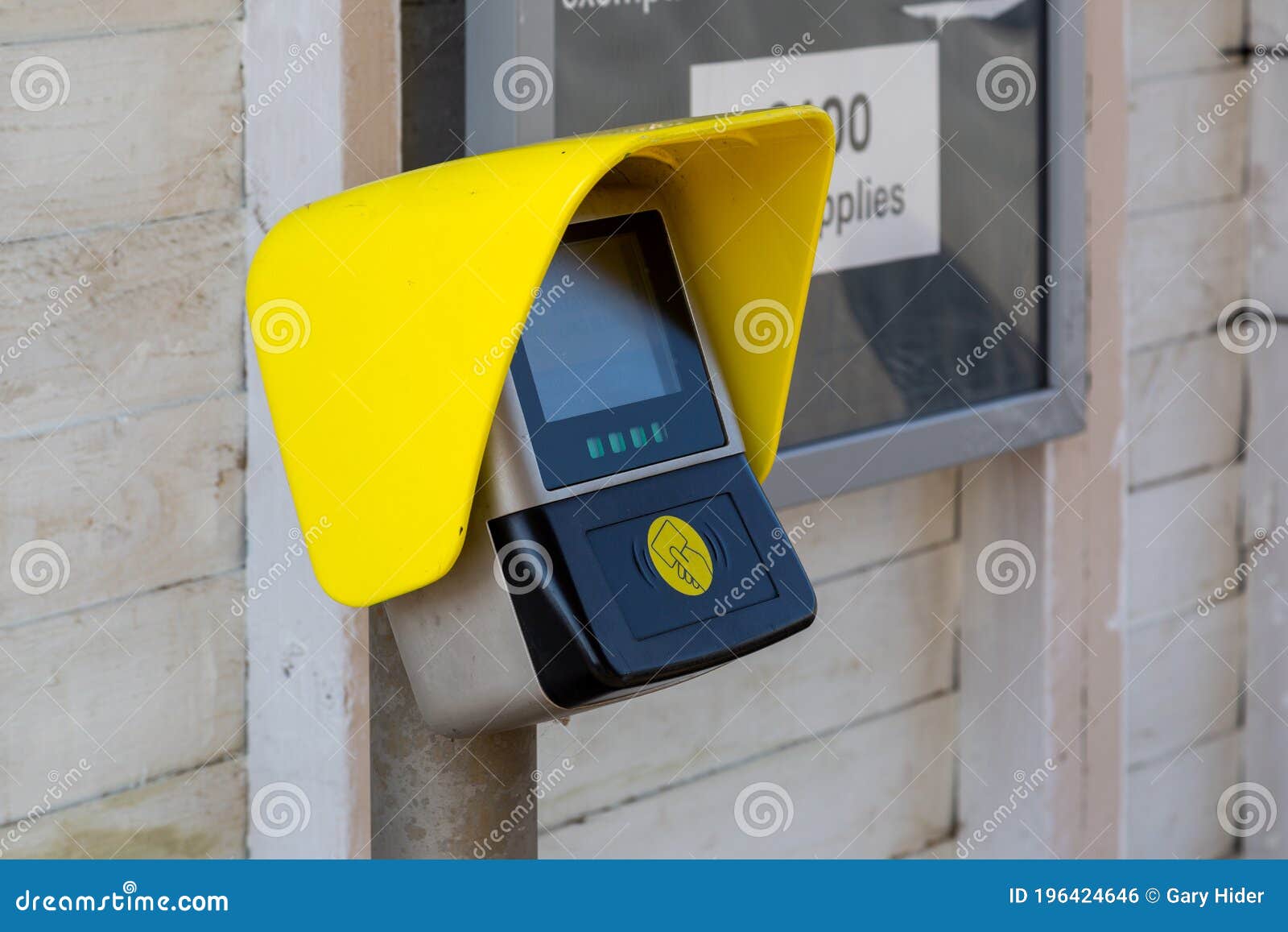 a ticket or travel card scanner point on a train station platform