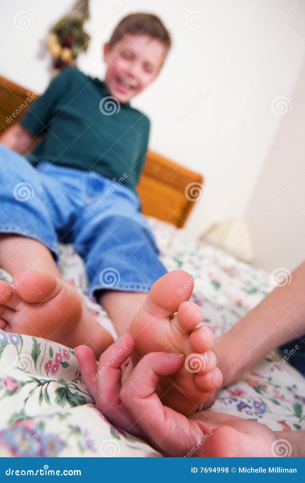 Male feet tickled