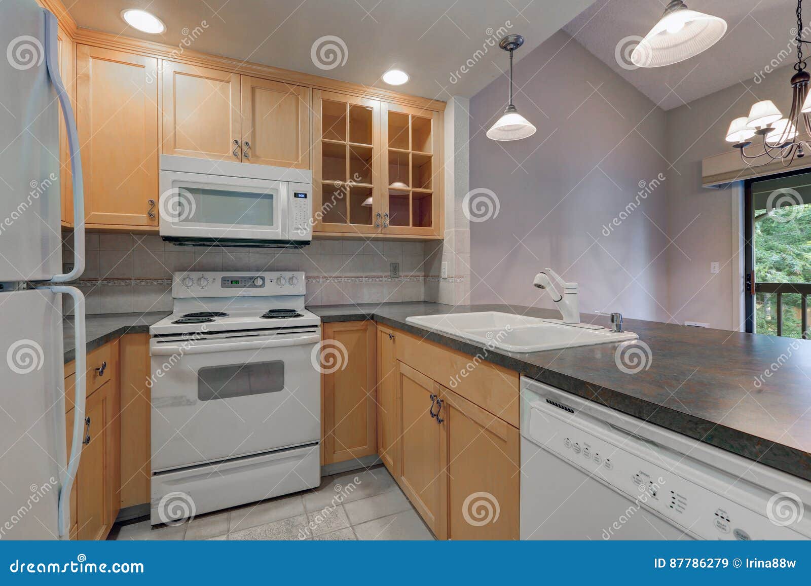 Tidy Compact Kitchen with Maple Cabinets Stock Image   Image of ...