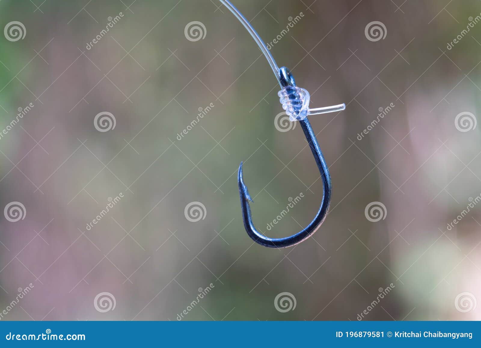 Tie a Snell Knot on Fishing Hook with Blur Background Stock Image - Image  of fishing, hanging: 196879581