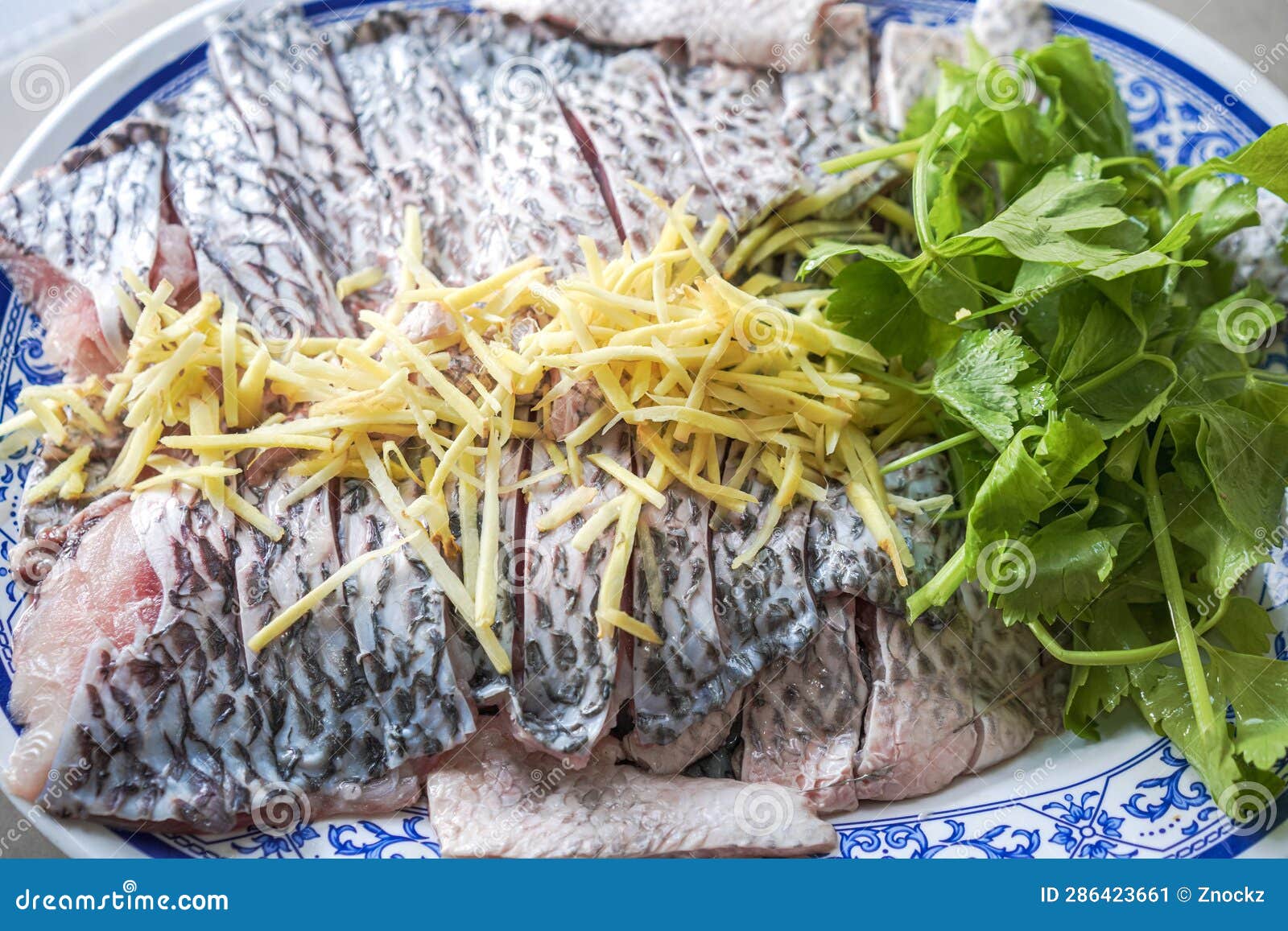 Tilapia Fish Fillet Prepare To Dip with Ginger Slice and Celery Stock