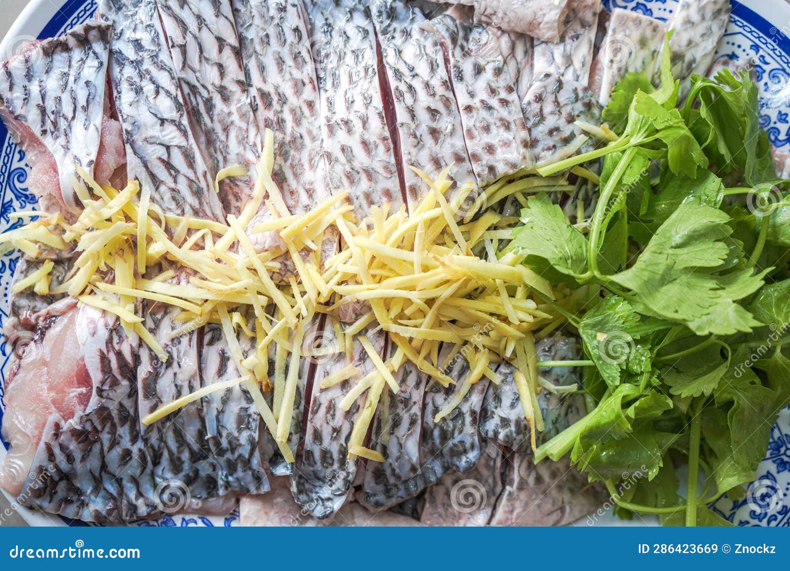 Tilapia Fish Fillet Prepare To Dip with Ginger Slice and Celery Stock