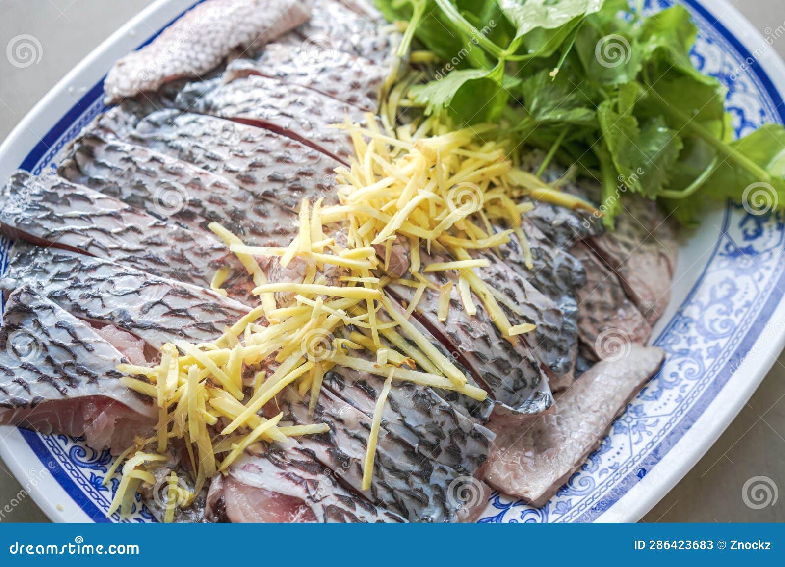 Tilapia Fish Fillet Prepare To Dip with Ginger Slice and Celery Stock