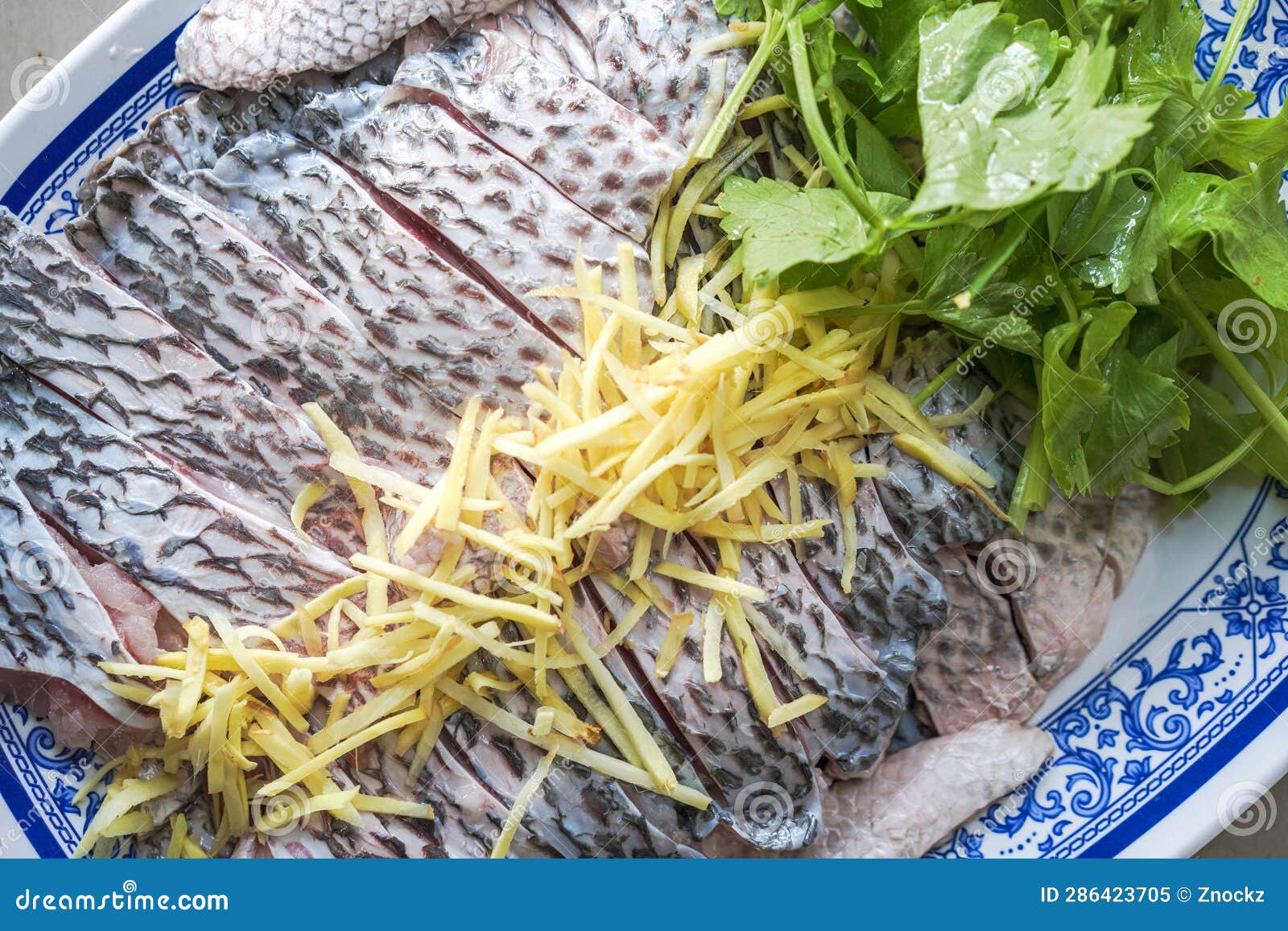 Tilapia Fish Fillet Prepare To Dip with Ginger Slice and Celery Stock