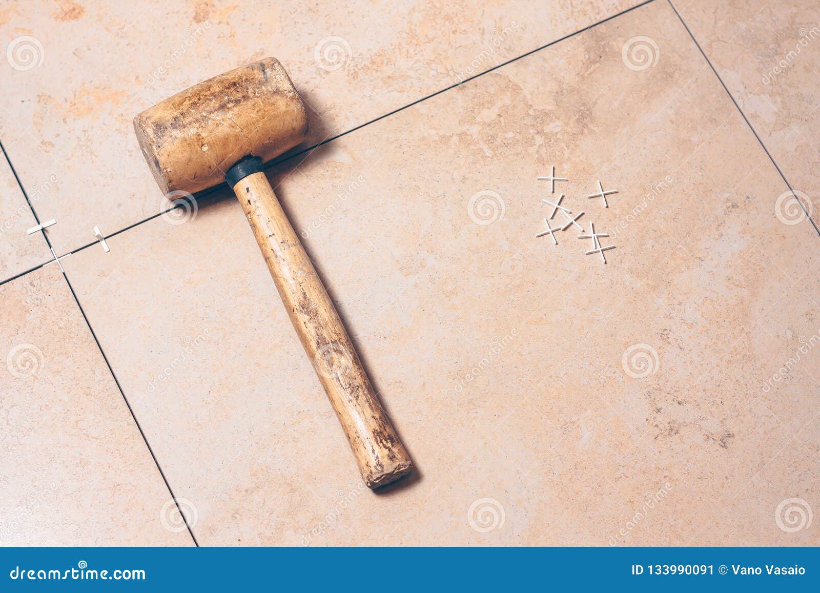 Tile mallet on the floor stock image. Image of ceramic 133990091