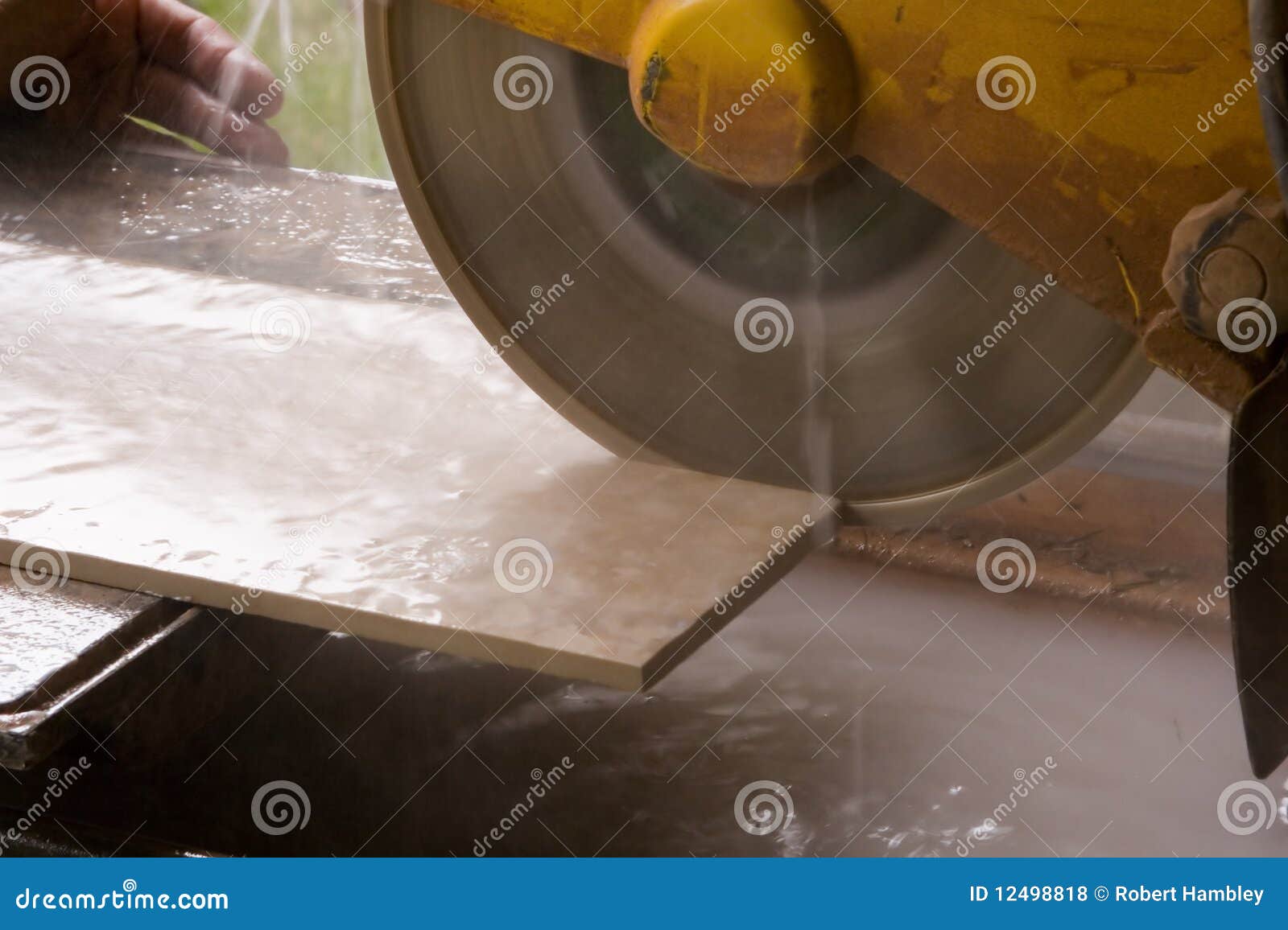 Tile saw cutting tile stock photo. Image of sawing, redecorate 12498818