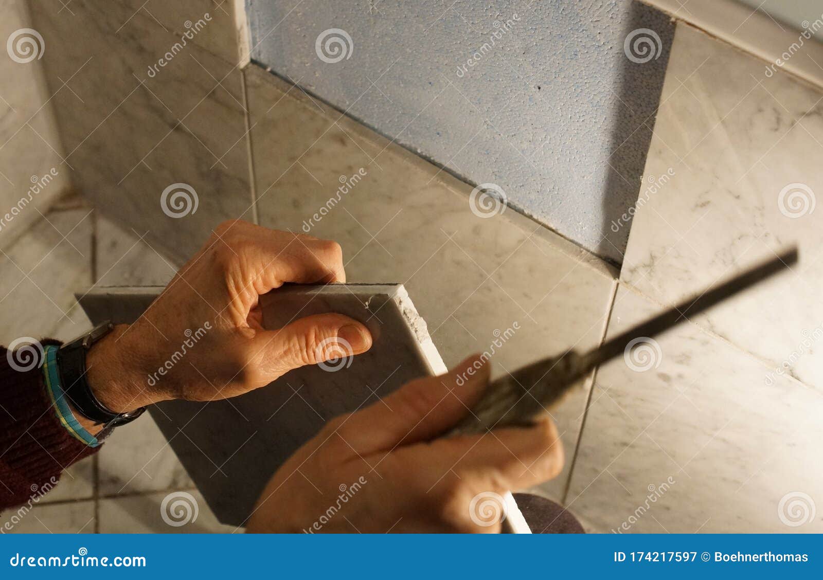 A tiler at work. stock image. Image of hand, tiler, floor 174217597