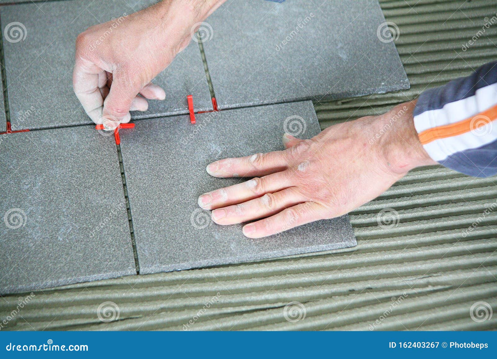 Tiler worker at work stock image. Image of ceramic, concrete 162403267