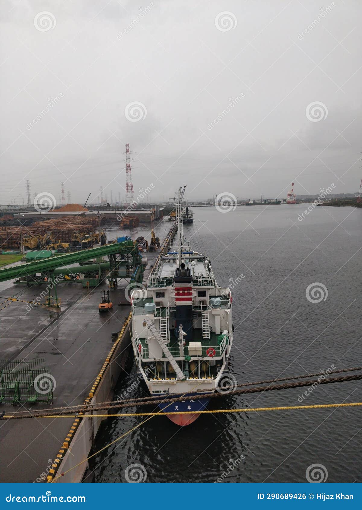 A Timber Carrier Ship Berthed and Waiting for Loading Stock Photo