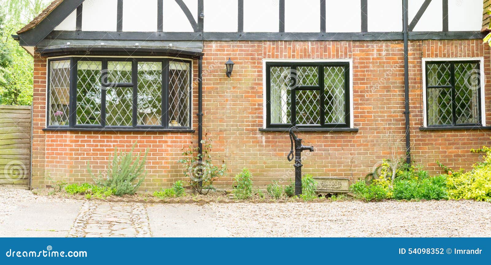 Timber Cottage bay windows stock photo. Image of 54098352