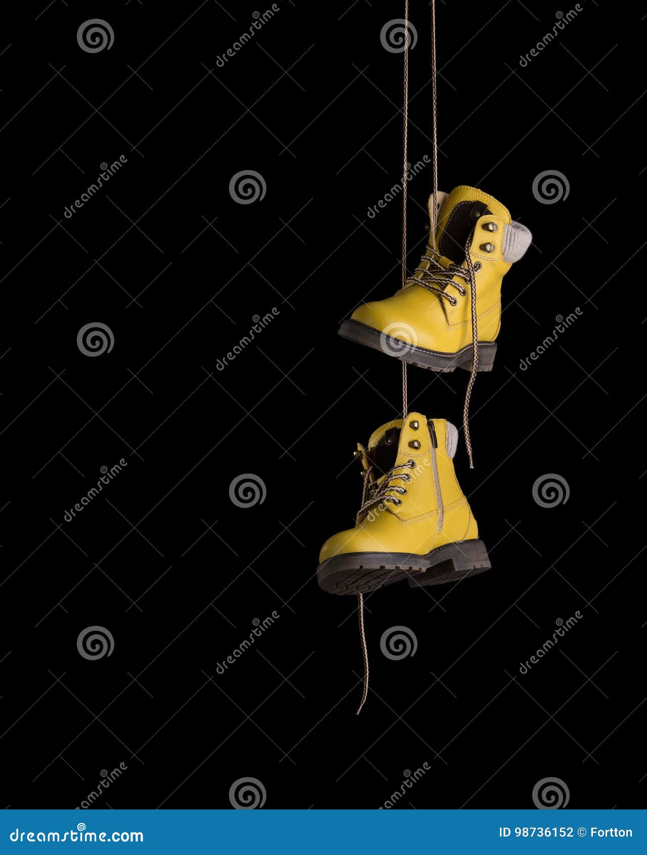 timberland boots yellow on a black background