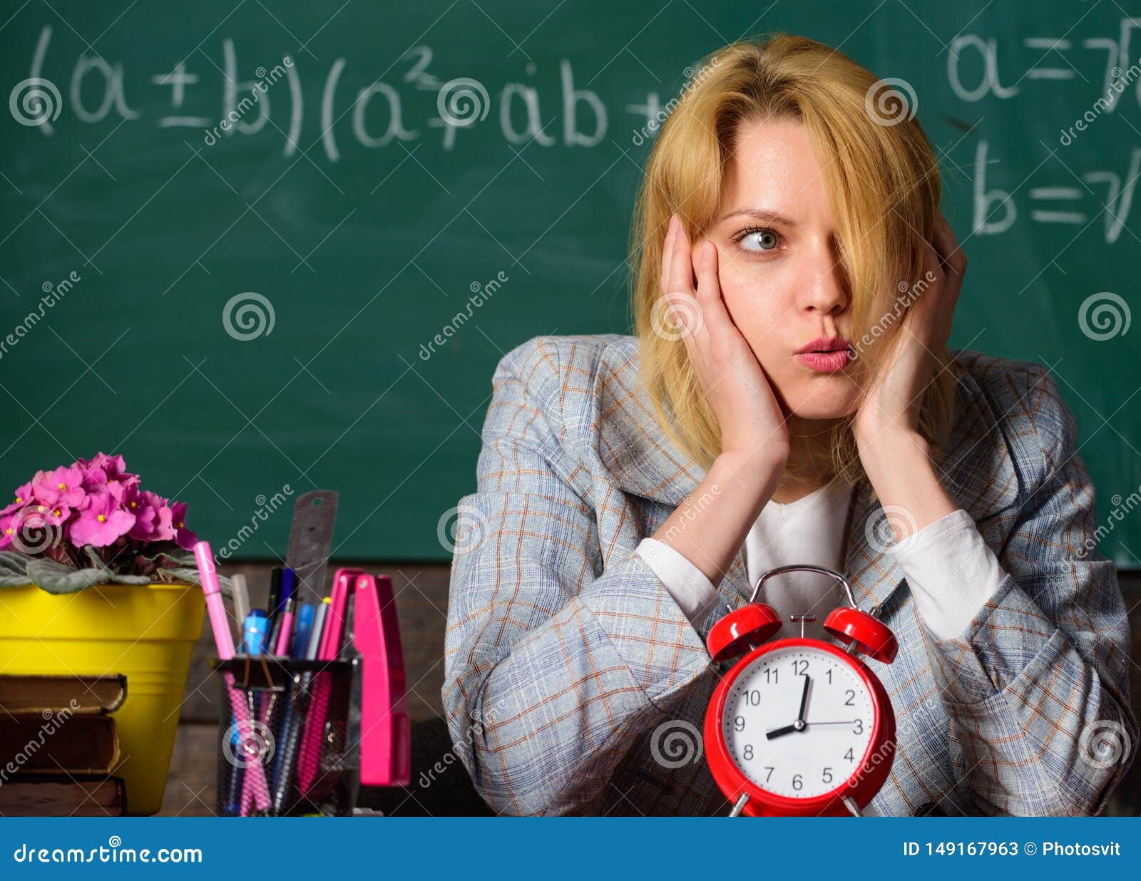 Time is gone. teacher with alarm clock at blackboard. Time. Back to school. Teachers day. Study and education. Modern